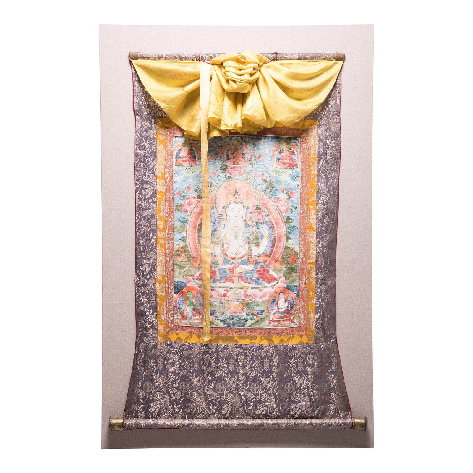 19th Century Tibetan Thangka of Chenresi on Silk: Thangkas are devotional paintings displayed by Buddhists in monasteries, temples, and even in their homes. The rich red, orange, green, and blue hues are still incredibly vibrant on this sacred