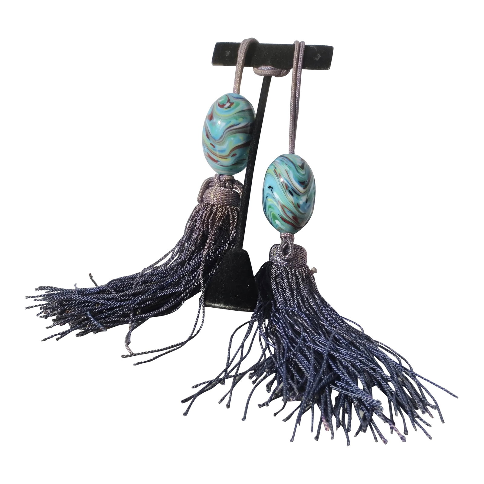 Vintage Chinese Glass Scroll Weights - a Pair of 2: Vintage Chinese glass scroll weights with soft faded tassels. Silvered faded denim blue colors. The glass is a swirl of robin egg blue with flowing brown, white, and green veining. Lovely and very