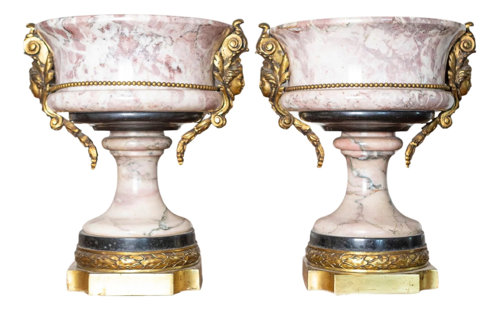 Pair of 19th-Century French Neoclassical Marble and Gilt Bronze Urns: This exquisite pair of 19th-century French urns showcases the elegance and craftsmanship of the Neoclassical period, featuring finely carved pink veined marble complemented by gilded bronze ormolu