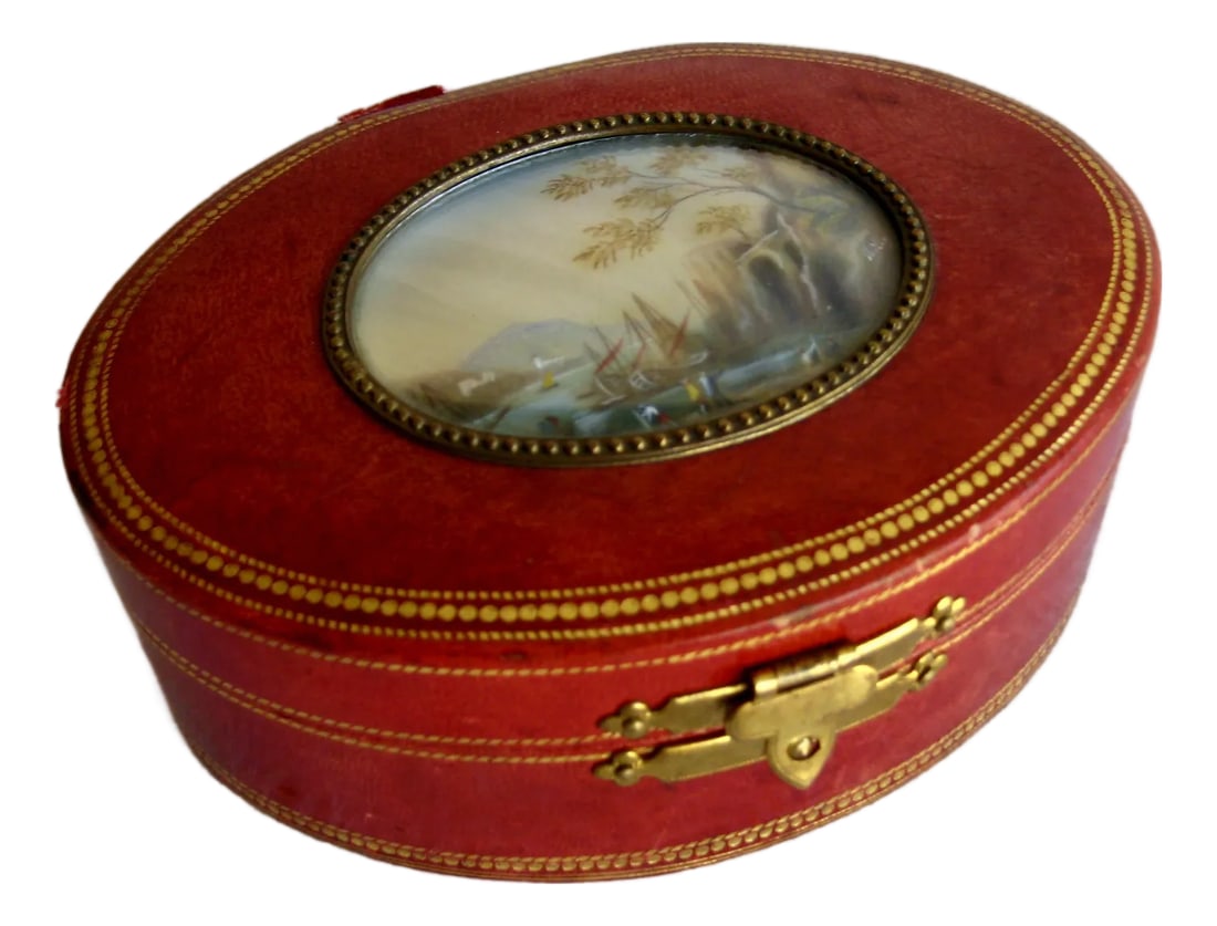 Mid 20th Century Leather Italian Jewelry Box With a Miniature Painting: This lovely leather box present is ornate on top with a miniature painting showing a charming landscape with boats and is very well executed , it is sign on the side , but hard to read , anyway the