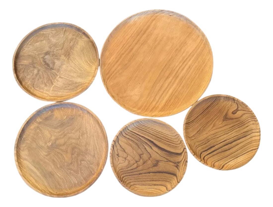 Andrianna Shamaris Minimalist Teak Wood Plates - Set of 5: Set of five low profile minimalist plates. So many uses for these simple yet unique accessories. Finished with a natural oil revealing the beautiful wood grain. Full dimensions; x 1 at 16" diameter,