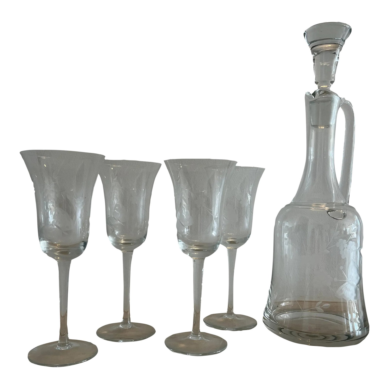 Vintage Etched Glass Decanter & Set of 4 Wineglasses Featuring Butterfly and Grapevine Motif: Simply elegant and delicate, this decanter and wineglass set features an etched butterfly and grapevine motif. Each piece is in excellent vintage condition, no chips or cracks. The heavy glass