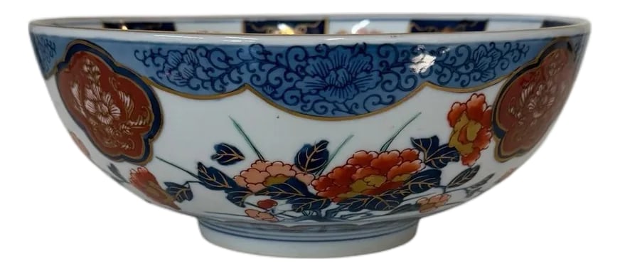 Vintage Chinoiserie Hand Painted Imari Style Decorative Bowl Marked With Arita Banreki Japanese Blue: Vintage hand painted chinoiserie Imari style decorative bowl marked with Japanese Porcelain Arita Banreki blue characters. Sides are embellished with orange and blue florals outlined in gold. Eye