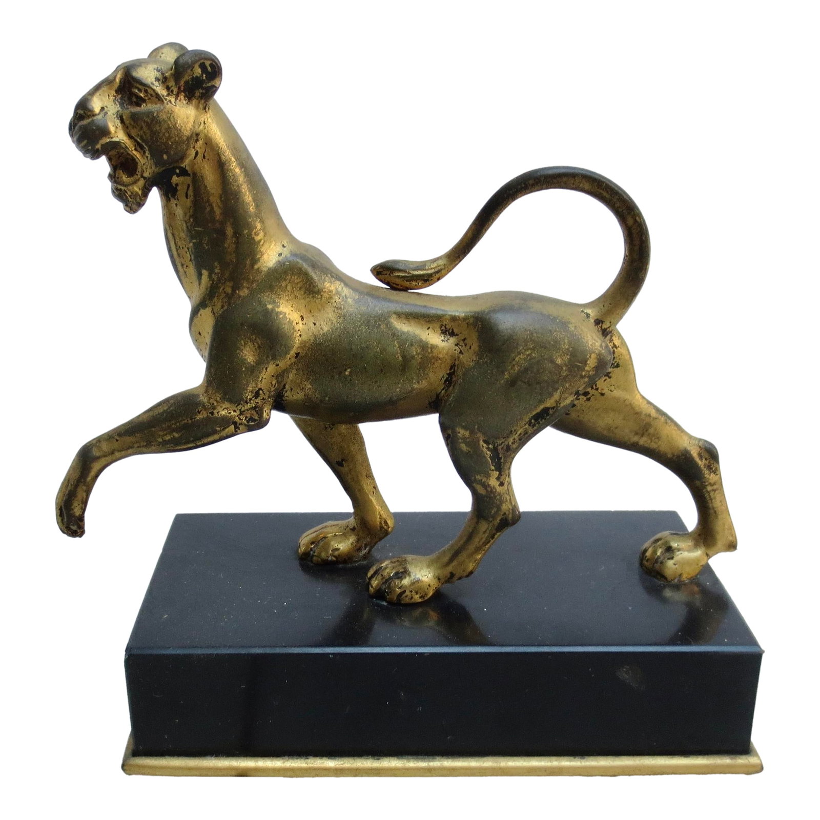 E. F.Caldwell and Co. Gilt Bronze Panther Circa 1900: E.F Caldwell gilt bronze panther on black marble base. Gilt and marked E F Caldwell to the rim of the marble base. A panther figure derived from the Grand Tour.imagery found on Handles and in the figu