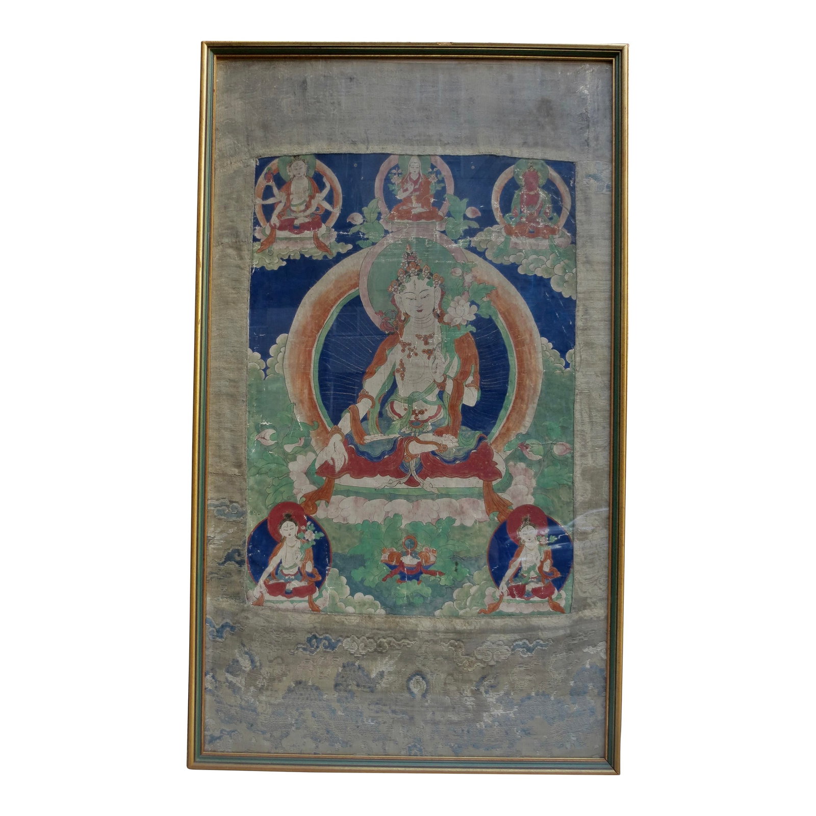 Antique Tibetan Tanka White Tara 18th: Antique Tibetan tanka of White Tara surrounded by a pantheon of Buddhist Dieties. 18th century Chinese school tanka paintings. Mounted in the original silk embroidery. The imagery depicts the White