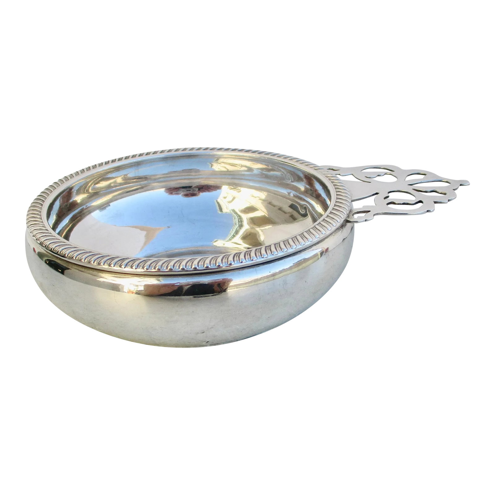 Fisher Porringer Sterling Silver Circa 1970s': Fisher sterling silver porringer bowl in a Georgian style with a gadrooned edge. Hallmarked to the bottom with F,6880, Sterling, and crest and crown. The side is 4.5" in diameter at the bowl. From