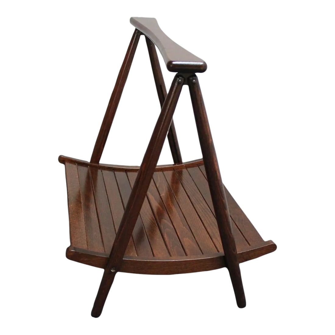 Vintage Yugoslavian Nasco Stained Beechwood Collapsible Magazine Rack: Yugoslavian magazine rack in stained beechwood manufactured by Nasco (ca. late 1960s, early 1970s). Sculptural form with slat-constructed basket with carved 'bowtie' handle. The basket folds up, and