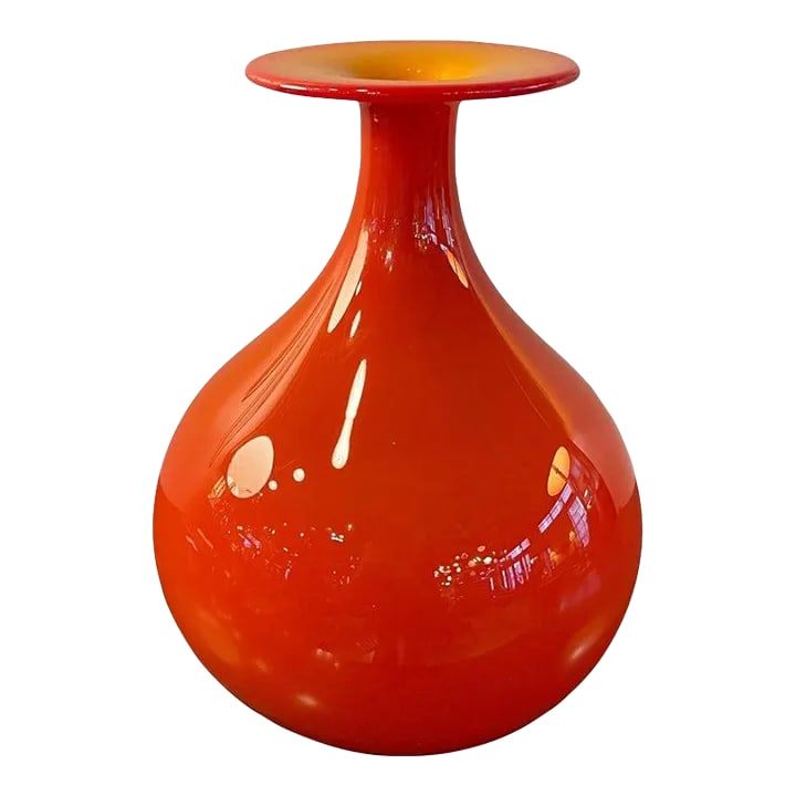 1960s Mid Century Modern Art Glass Vase by Tom Connally, Greenwich Flint Craft: Mid century modern, art glass vase by Tom Connally for Greenwich Flint Craft in brilliant, opaque orange with contrasting orange ochre top. The mouth opening measures 1 inch. Condition: Alterations:
