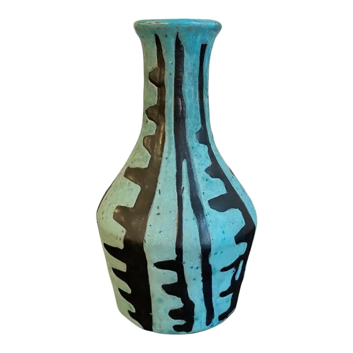 1960s Tribal Style Modern Art Pottery Vase by Livia Gorka: Small, Mid-Century Modern, art pottery vase by Hungarian artist Livia Gorka features a hand-painted, tribal motif in black and blue. The mouth opening measures 1 inch. Condition: Alterations: Original