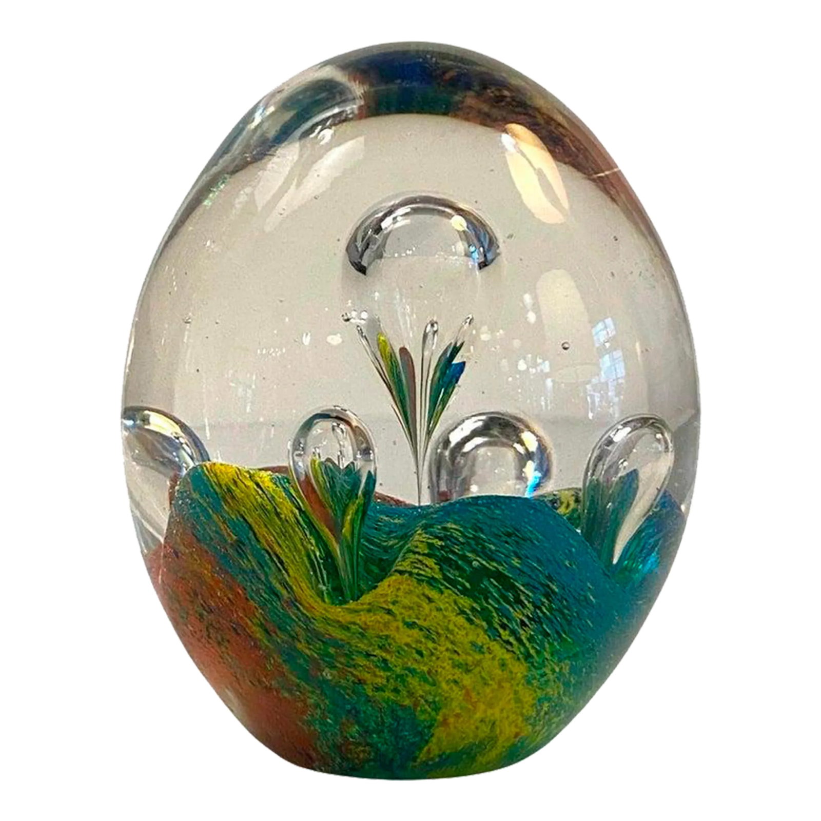 1980s Italian Murano Style Rainbow Bubble Art Glass Paperweight: Oval shaped, artisan-made, hand-blown, Italian Murano art glass paperweight features a bed of colorful teal, blue, yellow, and red with clear bubbles rising resembling hot air balloons. It's a