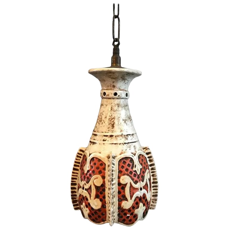 Midcentury Orange and White Morrocan Moorish Ceramic Pendant Light: Vintage, midcentury, Moorish pendant light features a patinated, white and deep orange ceramic shade with perforated body on a brass fitter and chain. This light has been rewired for 150 watts bulb