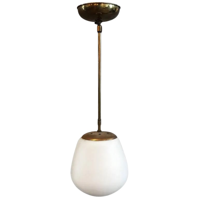 Danish Modern White Frosted Glass on Brass Pole Pendant: Danish Modern pendant light features a frosted white, size 8 in x 8 in oblong shade with brass pole and canopy. Condition: Alterations: Restored Imperfections: Some Imperfections Condition Notes:
