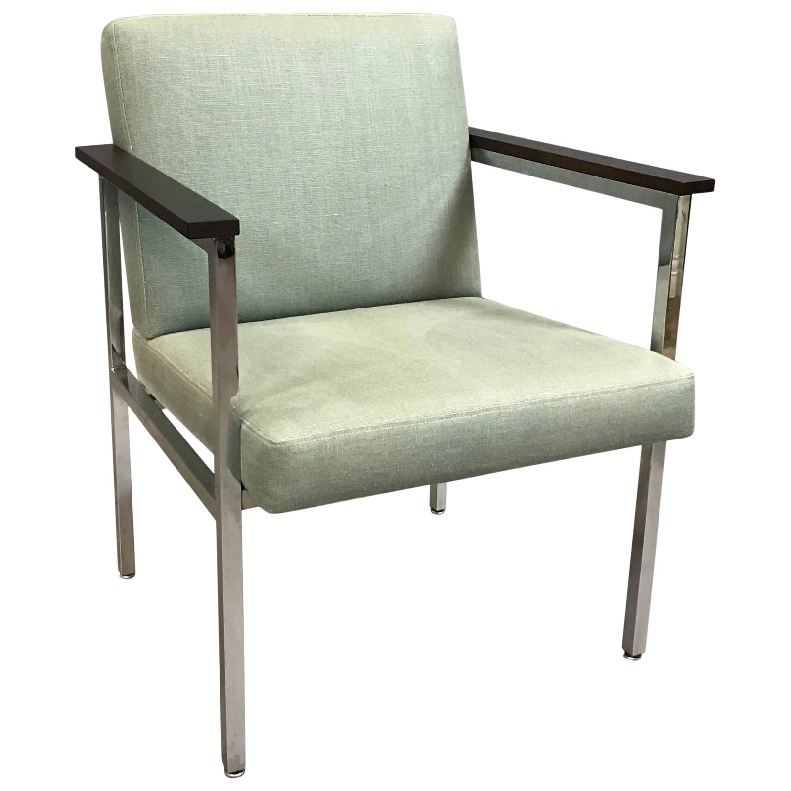 Mid-Century Modern Upholstered Chrome Armchair: Mid-Century Modern, 1970s, chrome framed armchair features ebonized maple armrests and newly upholstered seat and back in a moss green, cotton linen blend. Condition: Alterations: Restored Imperfectio