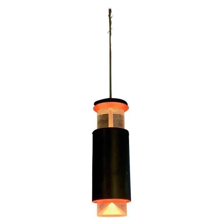 Danish Modern Lucite and Aluminum Cylinder Pendant Light by Simon Henningsen: Danish modern, cylinder pendant light by Simon Henningsen plays with color and shadow to create a minimal, modernist feel. The light features suspended Lucite bands at top and bottom with black painte
