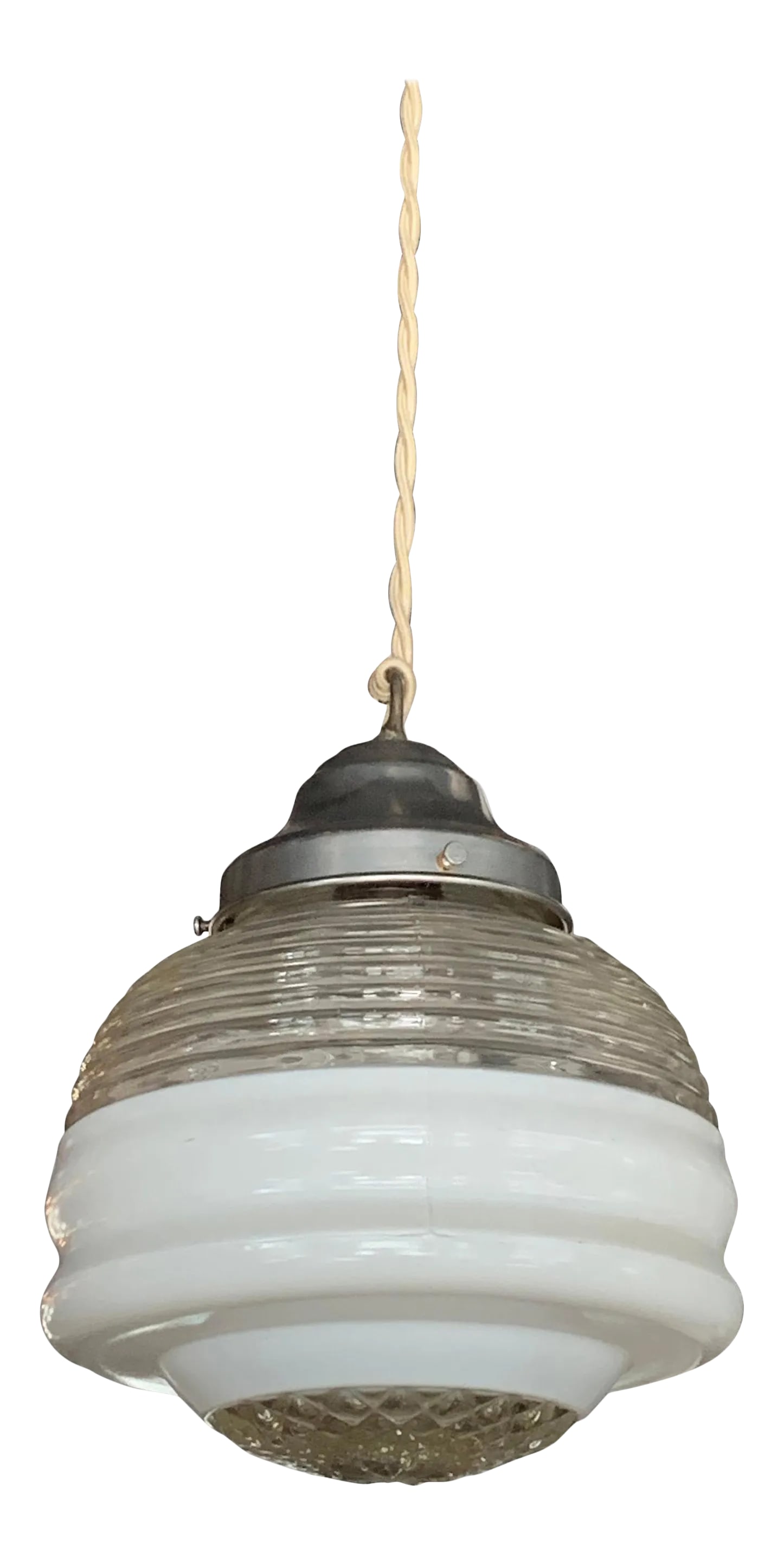 Early 20th Century Art Deco Layered Glass Pendant Light: Art Deco pendant light with a layered shade of ribbed, frosted and cut glass with aluminum fitter is newly wired with 48 inches of braided beige cord to accept a 150 watt bulb. Condition: Alterations:
