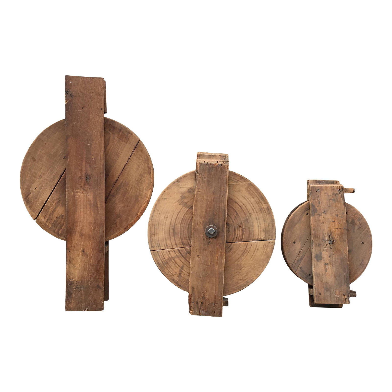 Trio of Antique Industrial Maple Dumb Waiter Pulleys: Trio of antique, industrial, maple wood dumb waiter pulleys circa the late 19th century are unique, early industrial objects. The trio consists of two large pulleys and one smaller. These interesting