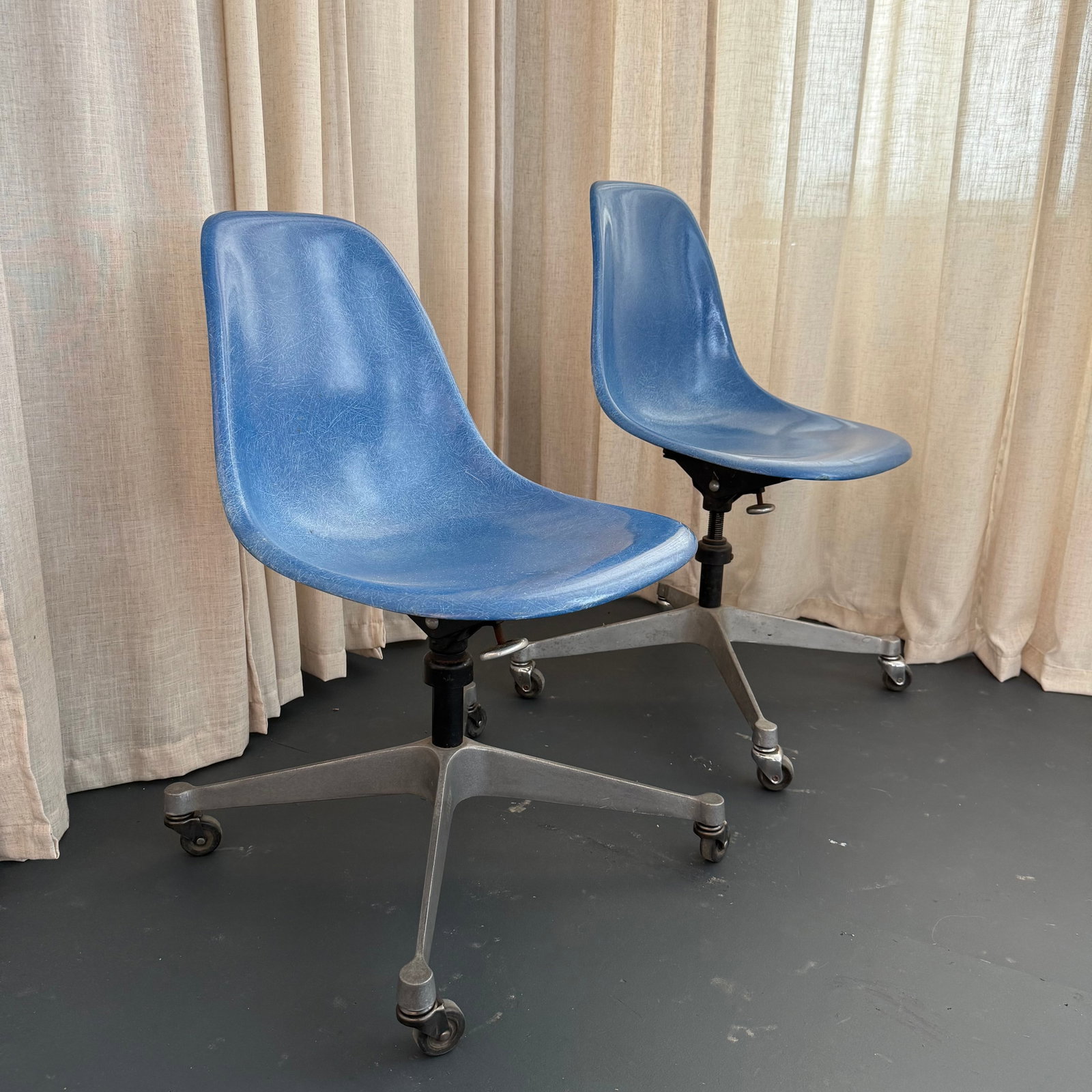 Pair of Eames for Herman Miller Blue Fiberglass Rolling Chairs - 2