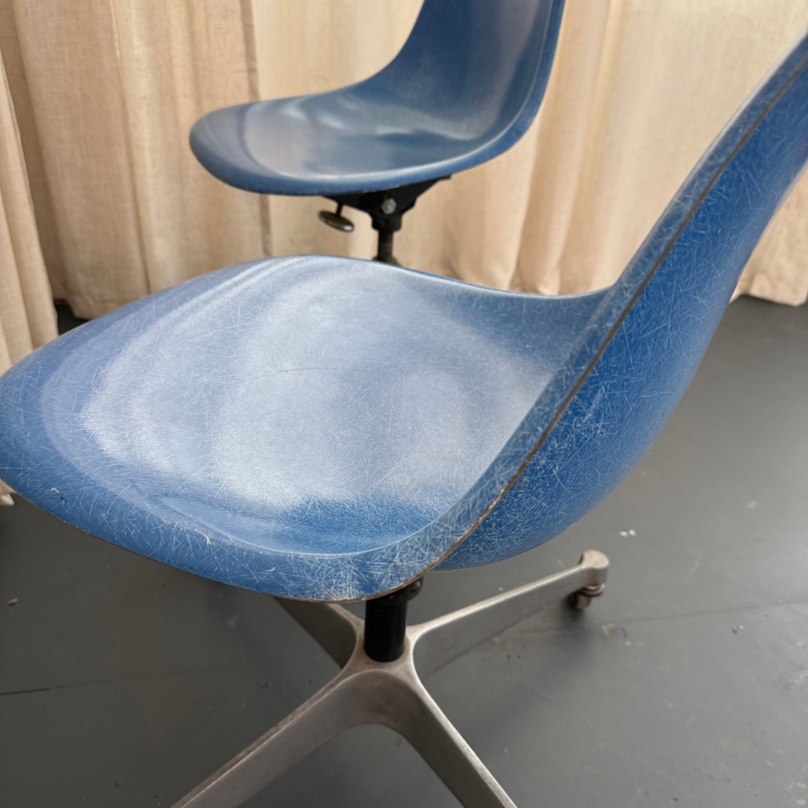Pair of Eames for Herman Miller Blue Fiberglass Rolling Chairs - 4