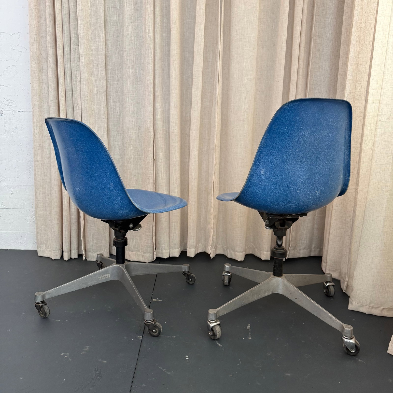 Pair of Eames for Herman Miller Blue Fiberglass Rolling Chairs - 6