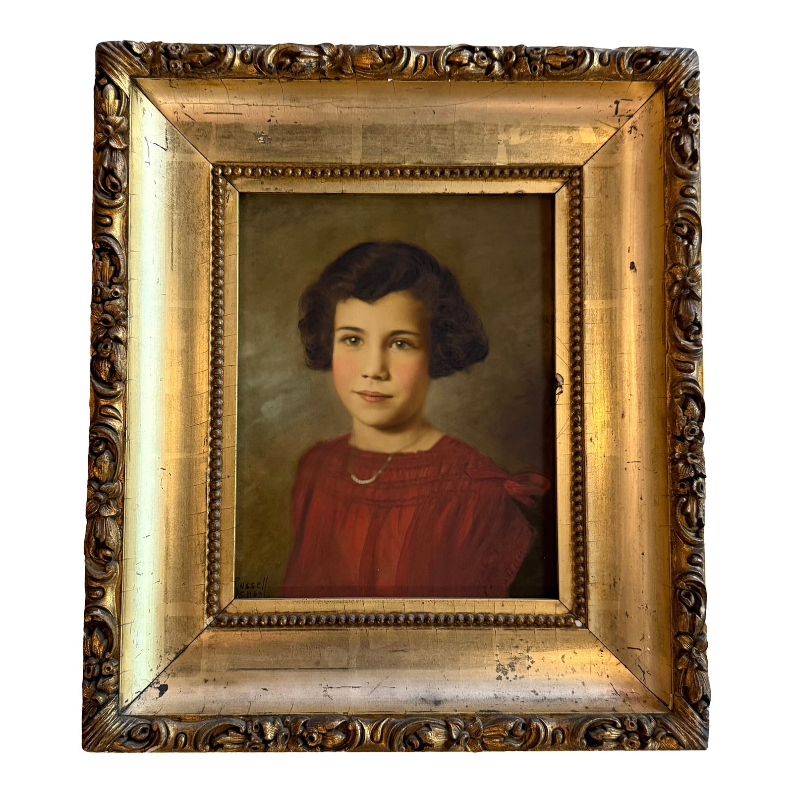 Early 20th Century Gilt Framed Portrait Painting of a Young Girl: This lovely early 20th-century portrait painting depicts a young girl in a vibrant red dress with neclace. The painting is rendered with remarkable sensitivity and soft, luminous brushwork attributed