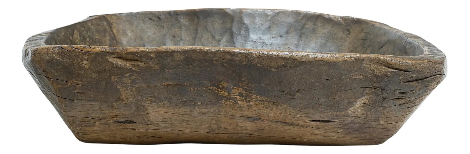 Provincial Chinese Farm Tray, circa 1900: This early-20th century wooden tray from northern China charms with rustic texture and asymmetric form. hand carved from a single block of wood, the tray has a rectangular shape with rounded corners,
