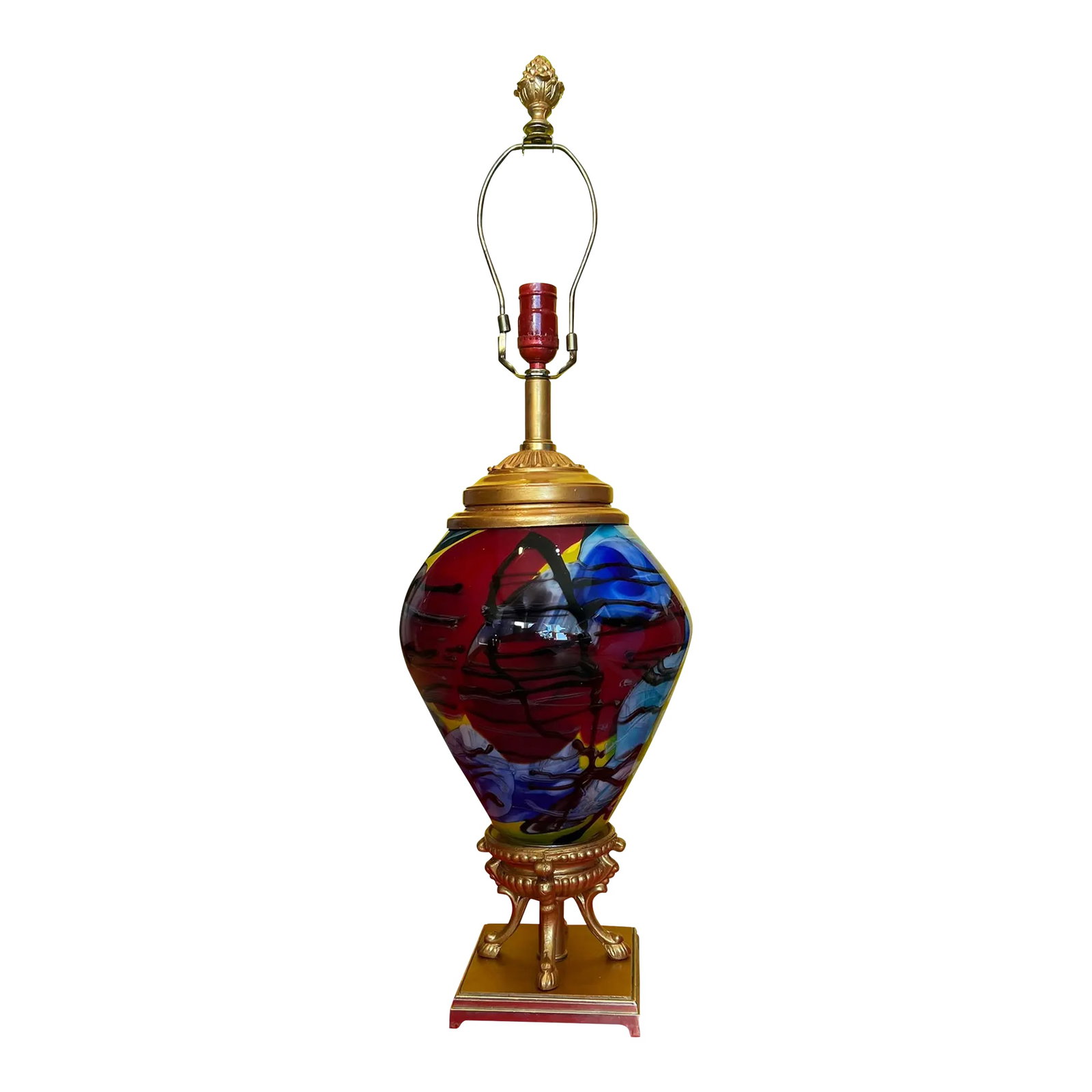 Art Glass Brass Abstract Multicolor Table Lamp: This exquisite lamp is a true statement piece, crafted from a blend of mid-century brass lamp parts and hand-blown art glass. Its large, bulbous, oval-shaped body is a work of art in itself, with mult