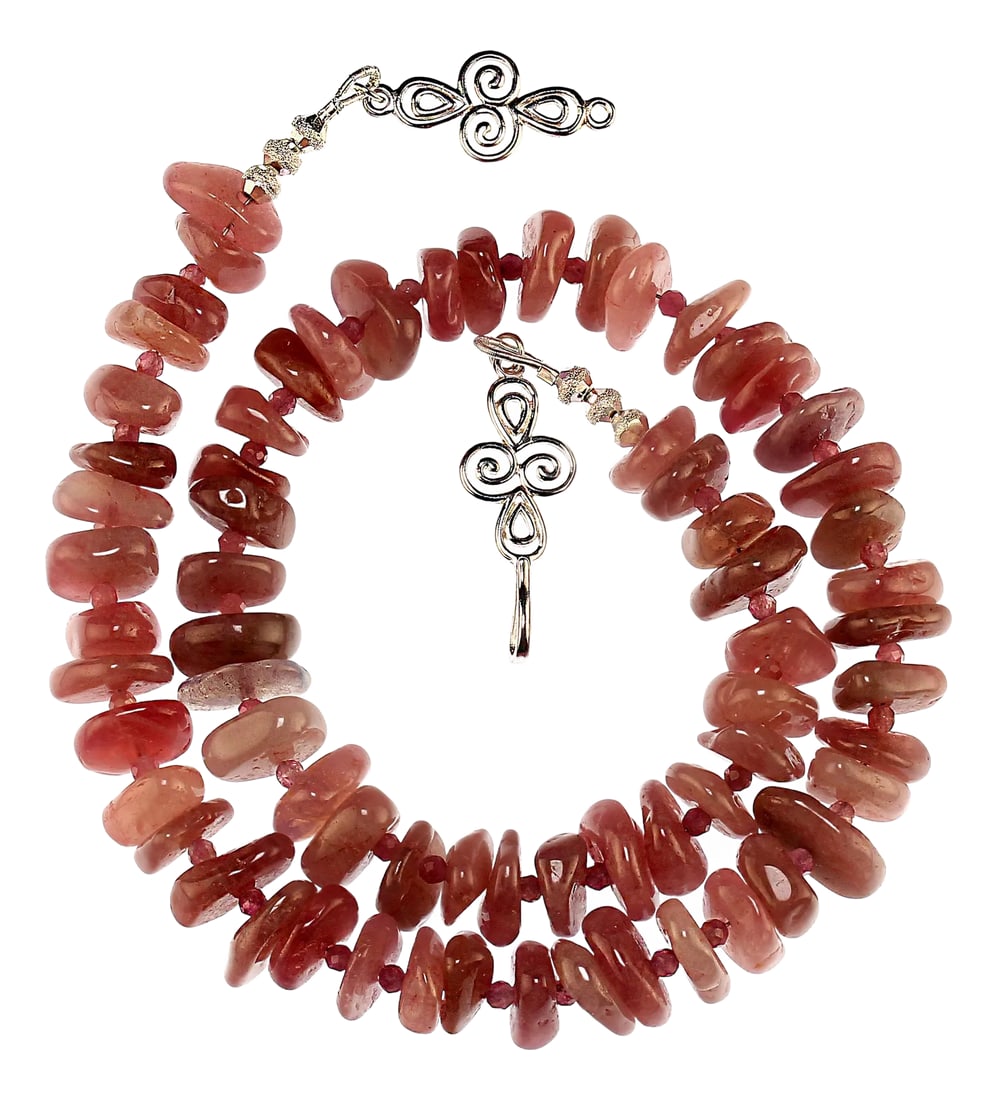 Unique Madagascar Rose Quartz Necklace: This exquisite necklace is a stunning statement piece made from natural mauve pink Madagascar rose quartz, known for its gentle, soothing color and energy. Each nugget is highly polished, showcasing
