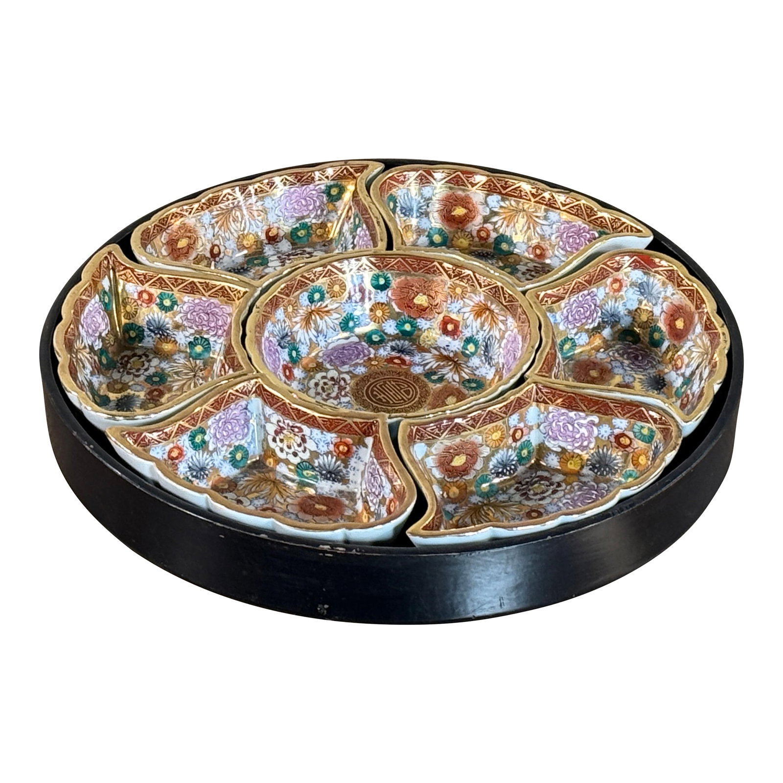 Antique Japanese Kutani Porcelain Divided Serving Bowl in Lacquered Lazy Susan: This c.1910/20's Japanese Kutani porcelain divided serving bowl (also known as a chirashi-zara) features a six-section petal form with dense hand-painted florals, iron red and green enamels, and rich