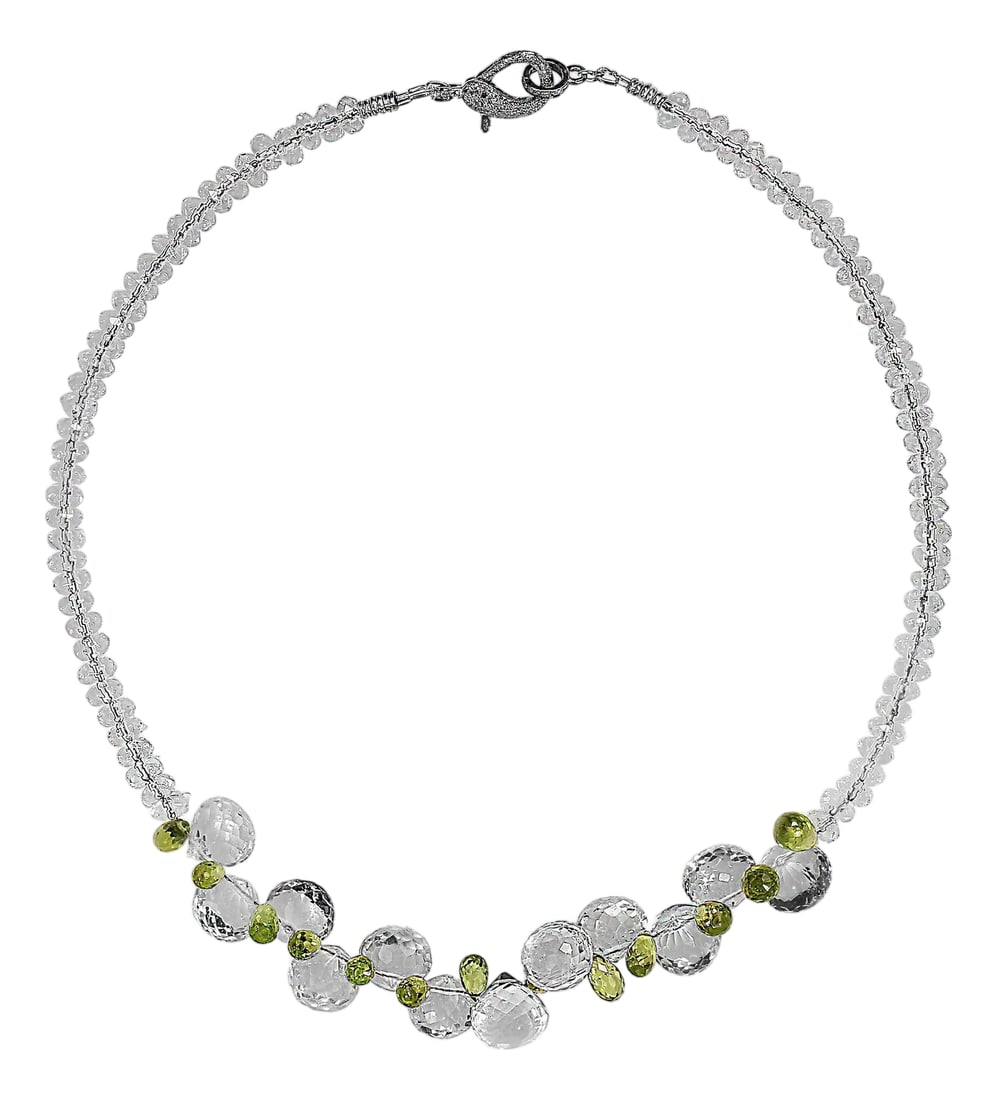 Ajd 17 Inch Sparkling Crystal and Peridot Necklace: This exquisite 17"‘inch necklace is a captivating blend of sparkle, color, and refined craftsmanship. At its heart are unique fat gumdrop"‘shaped crystal gems that catch the light with