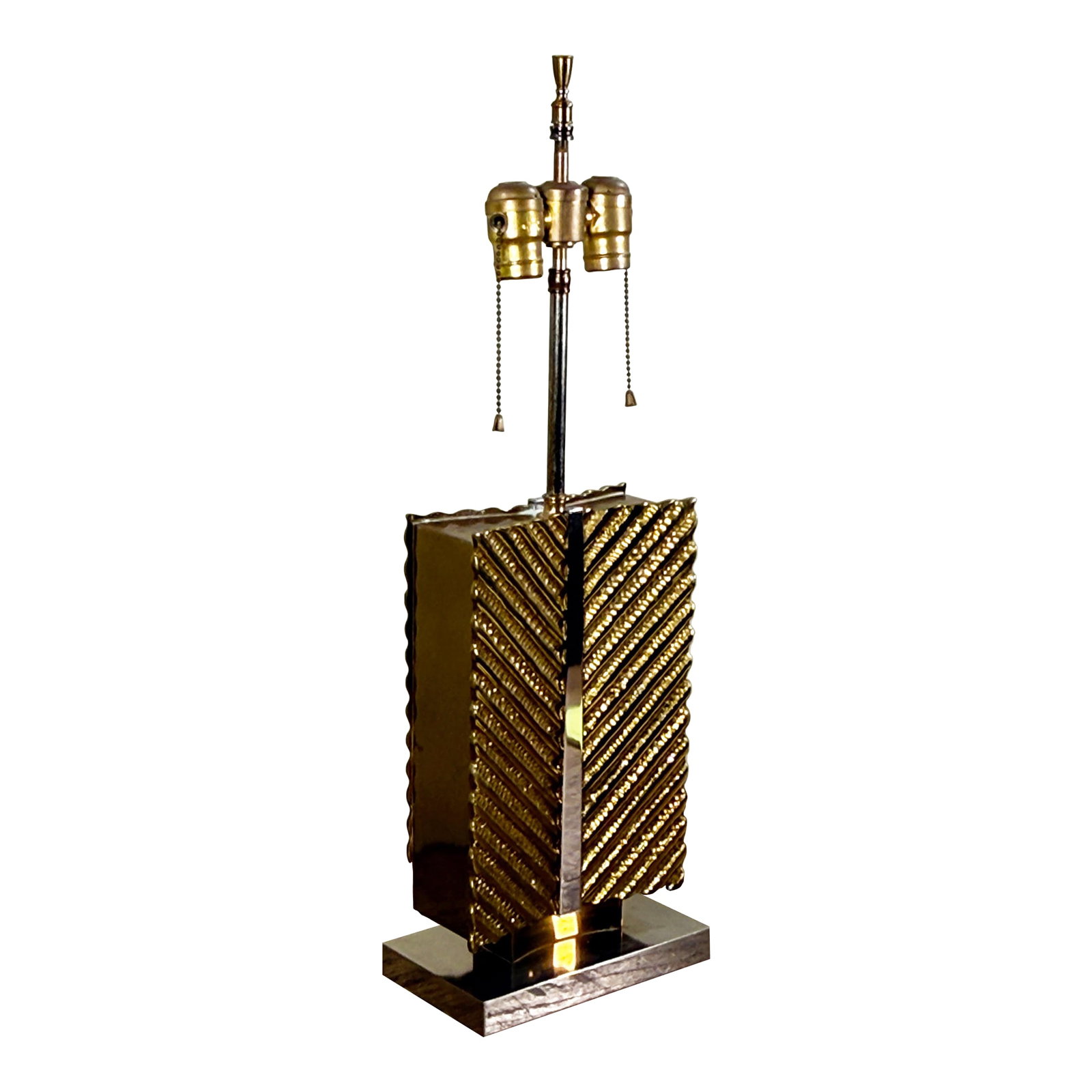 Vintage Hollywood Regency Maison Bagues Brass and Chrome Table Lamp: This table lamp by Maison Baguès features a rectangular brass body with diagonal striped texturing creating a chevron pattern across the four sides. The lamp is accented with chrome trim running