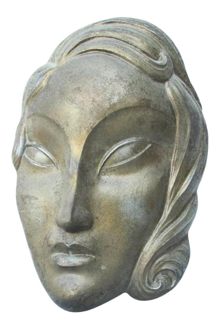 1920s Art Dec Spelter Female Wall Sculpture: Spelter (white metal ) wall sculpture of female face in high style art modern taste. A very refined reduction in the influence of Modigliani and the modernist. Almond eyes and a long thin face with