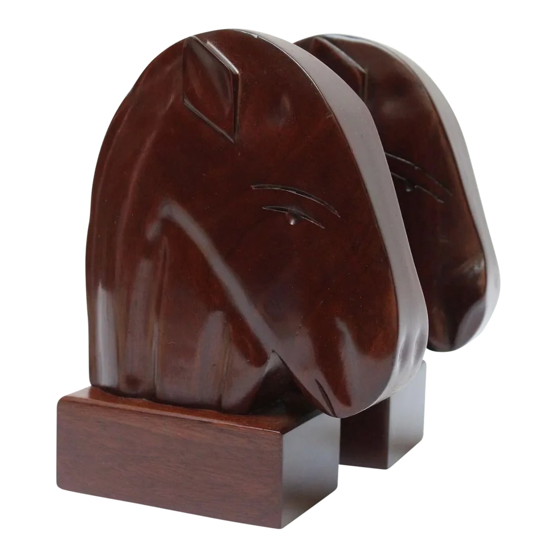 1950s Carved Solid Mahogany Horse Head Bookends- a Pair: Solid mahogany horse head bookends with hand-carved details by Carib Craft (Haiti, ca. 1950s). Handsome pair with original luxe mahogany finish. Very good, vintage condition with only minor wear