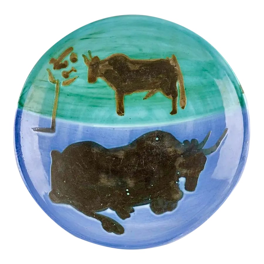 Pablo Picasso, Toros Plate: This Picasso ceramic plate, "Toros" is one in an edition of 500 and is made of white earthenware clay with englobes and oxidized paraffin decoration and enamel. The piece is stamped on the underside,
