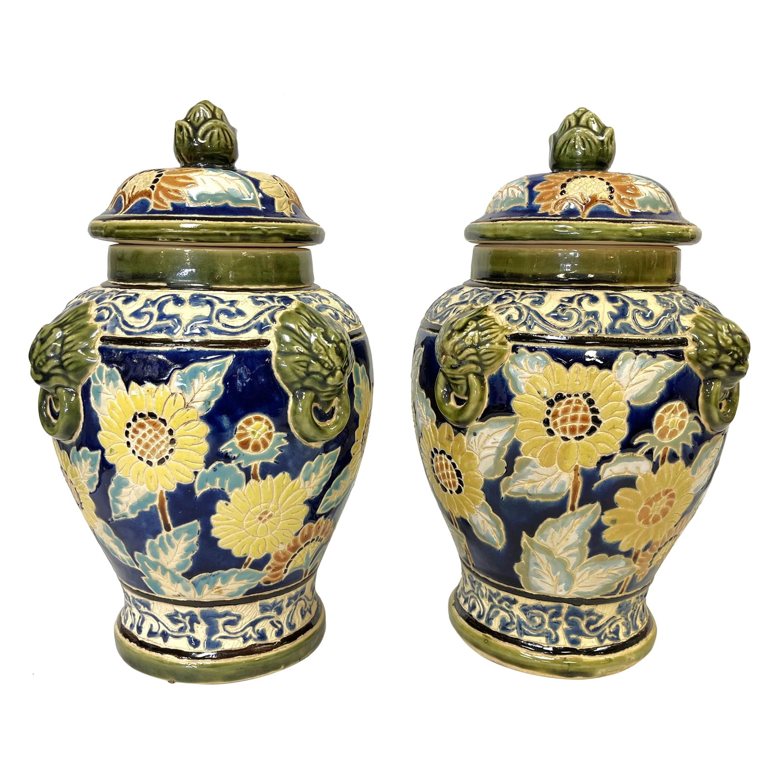 Large Vintage Sgraffito Pottery Lidded Urns With Lion Heads and Sunflower Details- a Pair: Brilliant pair of large vintage pottery lidded urns. They are made of ceramic decorated in the sgraffito technique with sunflowers and lions head details topped with an acorn style handle. They are