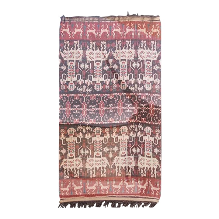 Large Antique Framed Sumatran Ikat: A magnificent antique Indonesianikat ceremonial throw, now encased in a custom plexiglass frame. This antique ceremonial throw showcases a remarkable weaving technique, presenting eight commanding