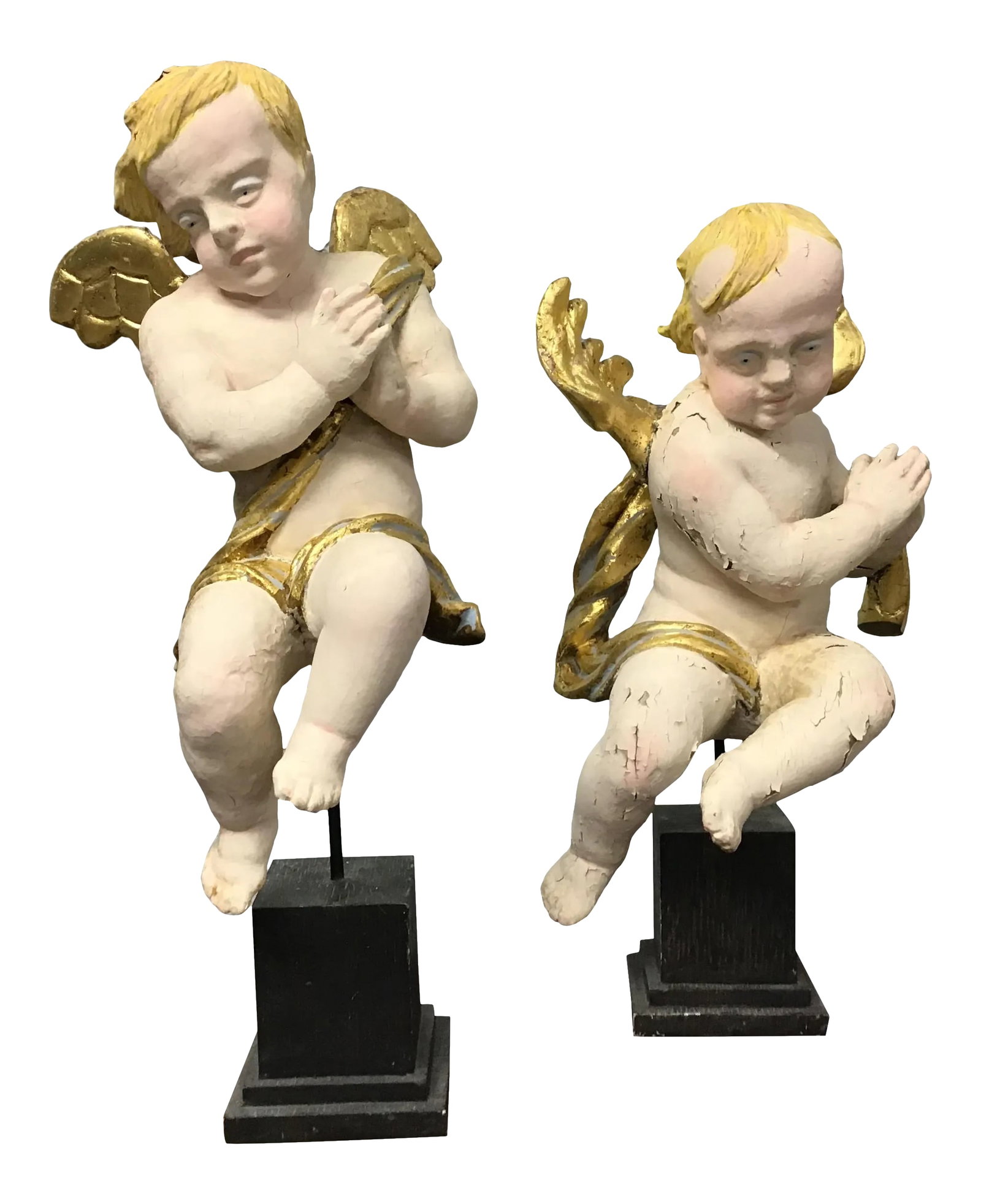 19th Century Wood Hand Carved Cherubs or Angels - a Pair: Pair of Cherubs or angels. Probably Italian. Hand carved wood and painted and gilt. Early 19th Century. Mounted on later stands. Or they can be hung on the wall. Wonderful old chippy chalky patina. 15