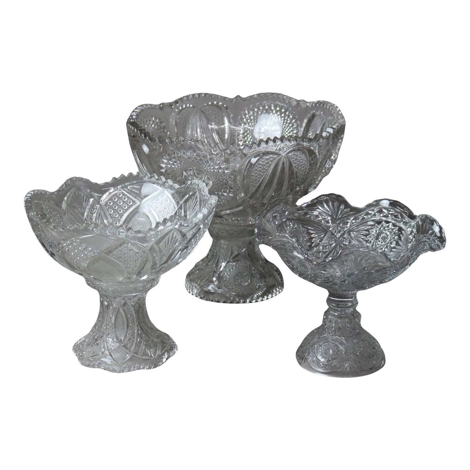 Circa 1920 Antique Pressed Glass Punch Bowls & Compote Set- 3 Pieces: Lot of Three Antique Pressed Glass Pieces, Two Punch Bowls with Stands and Compote C1920 Measures - 12.25"H x 14.5"W x 14.5"D (Largest) Condition: Alterations: Unknown Imperfections: Some