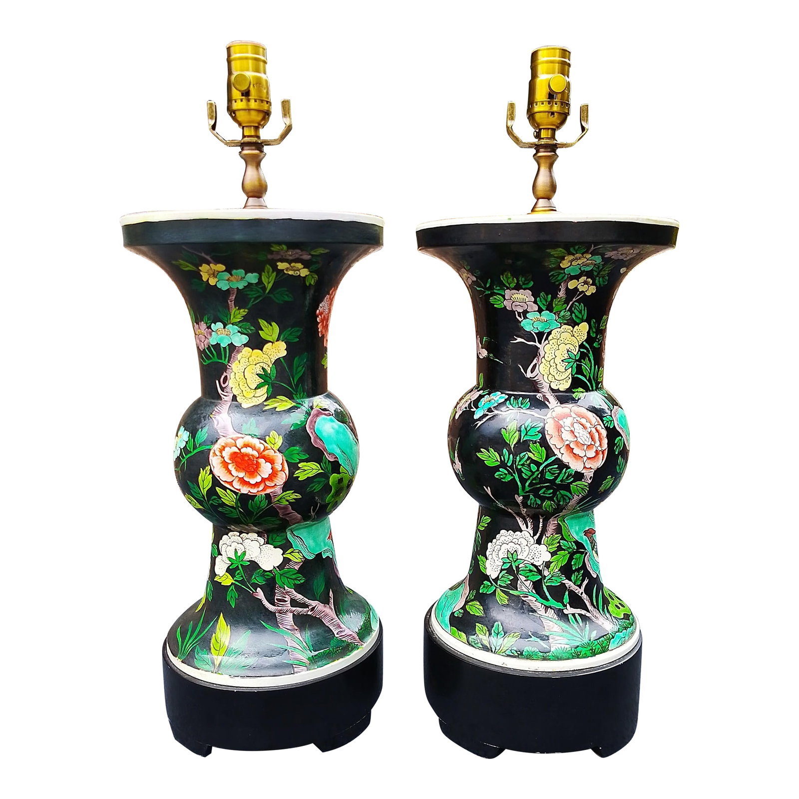 Pair of Vintage Chinese Cloisonné Vase Lamps: A striking pair of large vintage Chinese cloisonné vases, expertly converted into table lamps. Richly enameled with vivid green lotus leaves, flowering branches, and perched birds against a deep 