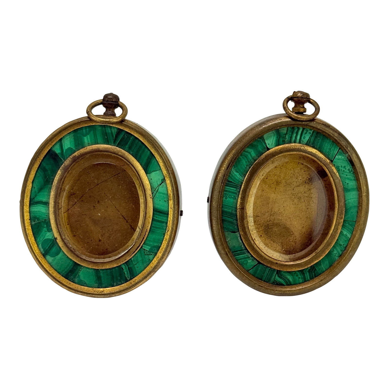 Pair of 19th Century Grand Tour Malachite-Inlaid Bronze Locket Frames, French: Each of these finely crafted Grand Tour–era oval locket frames is composed of patinated bronze and set with a band of inlaid malachite mosaic, framing a central glazed compartment for portrait m