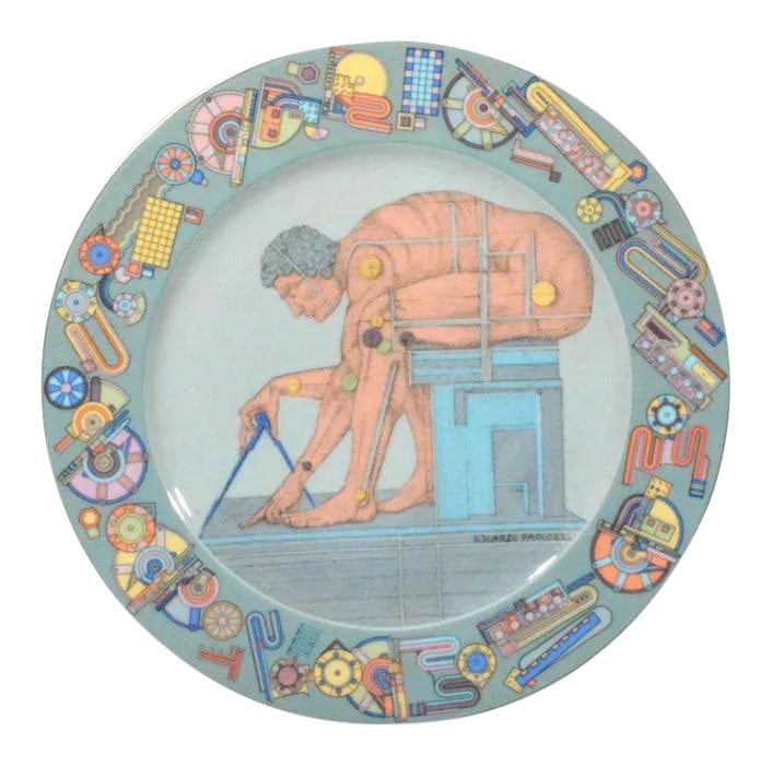 Eduardo Paolozzi's "After Newton" Rosenthal Porcelain Dish: The Machine-Man and the Philosopher: Paolozzi's "After Newton" Object: Decorative Plate, "After Newton," Motiv 1 Artist: Sir Eduardo Paolozzi (1924–2005) Manufacturer: Rosenthal, Studio-linie Or