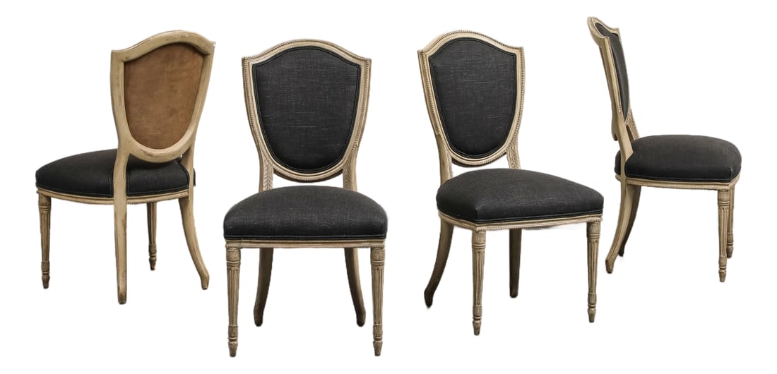 Set of 4 Louis XVI Style Side Chairs With New Linen and Suede Upholstery: A set of four side chairs designed in the Louis XVI style, featuring elegant shield backs. The chairs are newly upholstered in black linen on the seat and back, with the back featuring a contrasting t