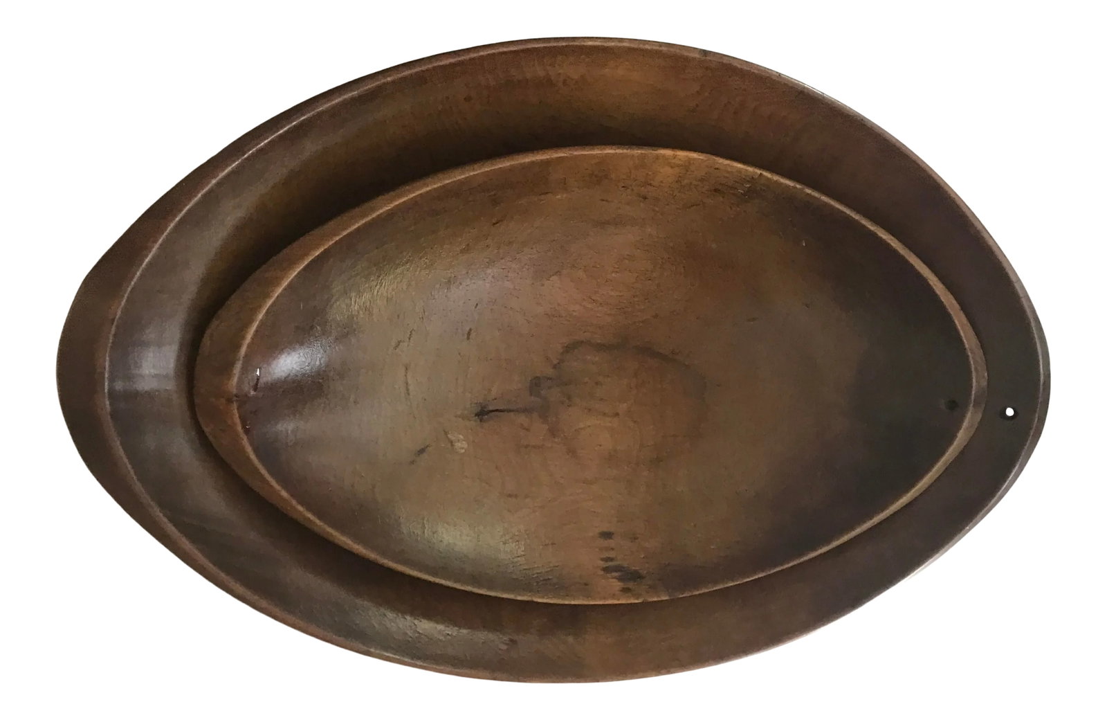 Carved Wood Dough Bowls a Pair: Hand carved oblaong wood dough bowls that fit nicely inside one another. Small holes on each bowl for hanging. The design almost looks Danish but I think they are American. Beautifully aged patina on