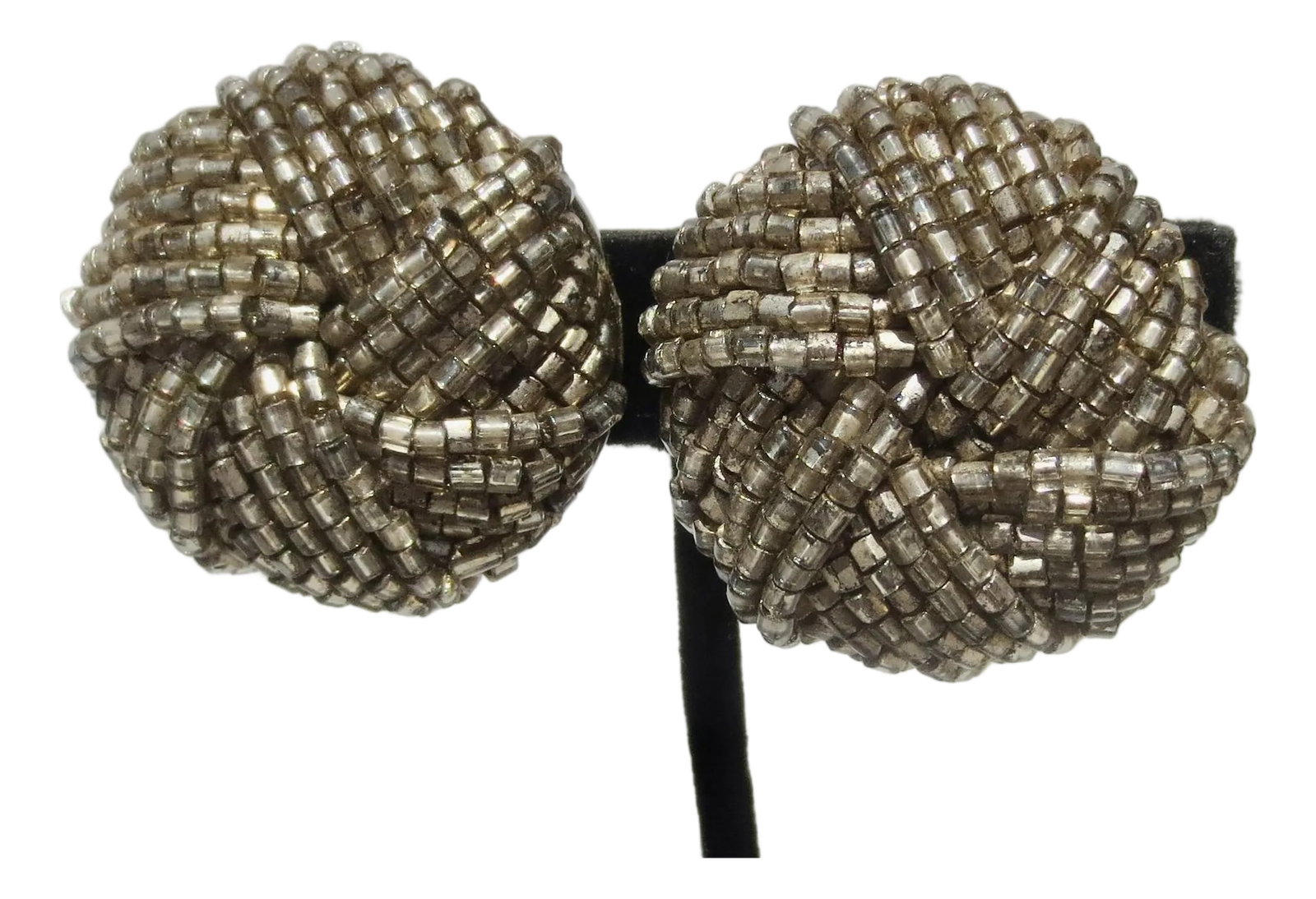Bugle Beads Earrings by Maria Calderara: White metal and grey beads rolled into a ball cluster. Marked on the back under the clip-on. Matia Calderara, Italy circa 1980s INV K-10 Condition: Alterations: Original Condition Unaltered