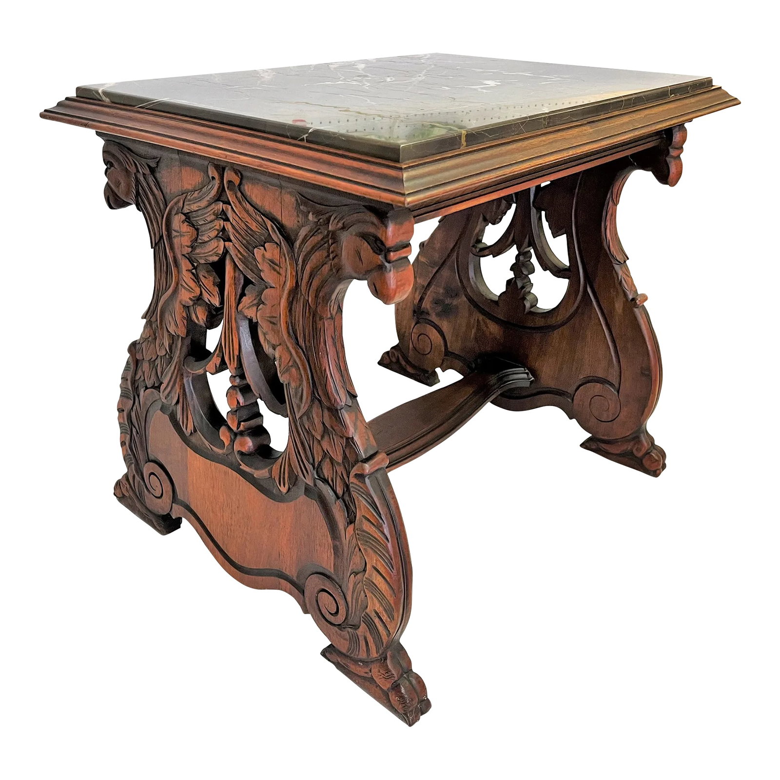 1940's Carved Lyre Leg With Eagle Details Side Table With Emperador Marble Top: Stunning 1940's Eastlake style side table. The piece features a carved mahogany wood base. Each side has a lyre shape with incredibly detailed eagle carvings. It has a thick marble inset 'picture