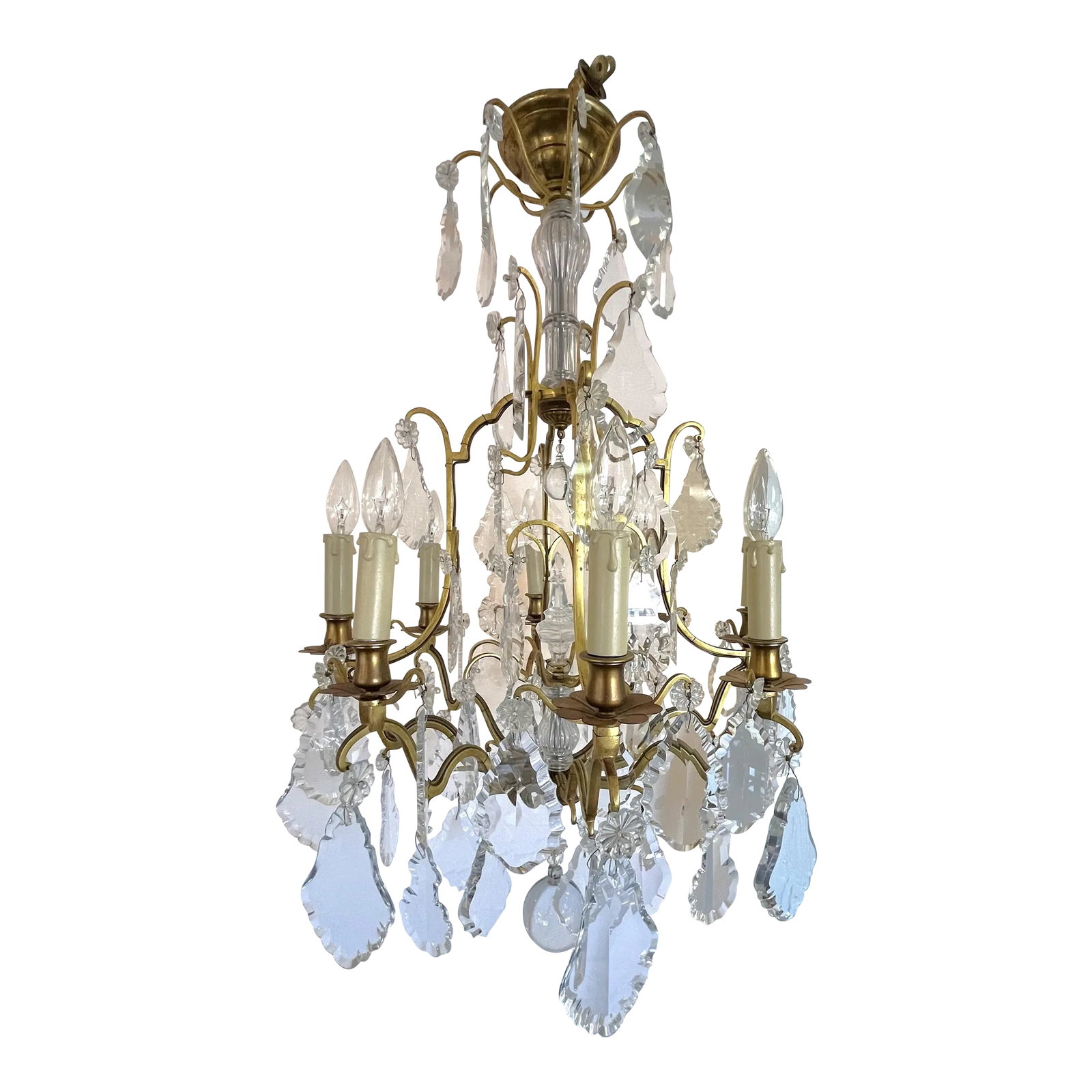 Early 1900's French Louis Xv Style Brass and Crystal Pendeloques 8-Light Chandelier: Stunning French Louis XV Style eight light chandelier from the early 1900's! It has a brass body with a slight aged patina. It's dripping with gorgeous Baccarat style crystals in pendeloque shapes