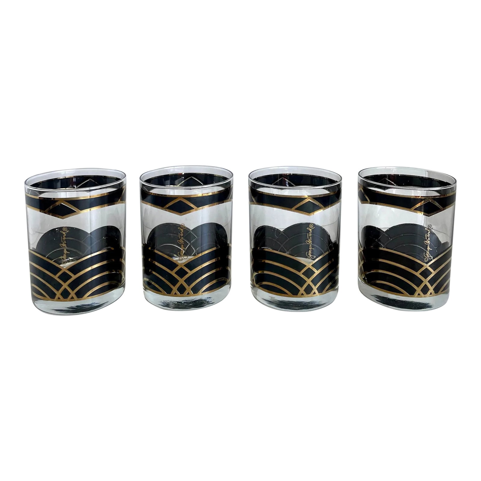 Vintage Georges Briard Art Deco Lowballs - Set of 4: Here is a gorgeous set of 4 lowball glasses with black and gold (actual gold!) painted details. Each glass bears the Georges Briard signature. The pattern is very art deco and perfect for amping up