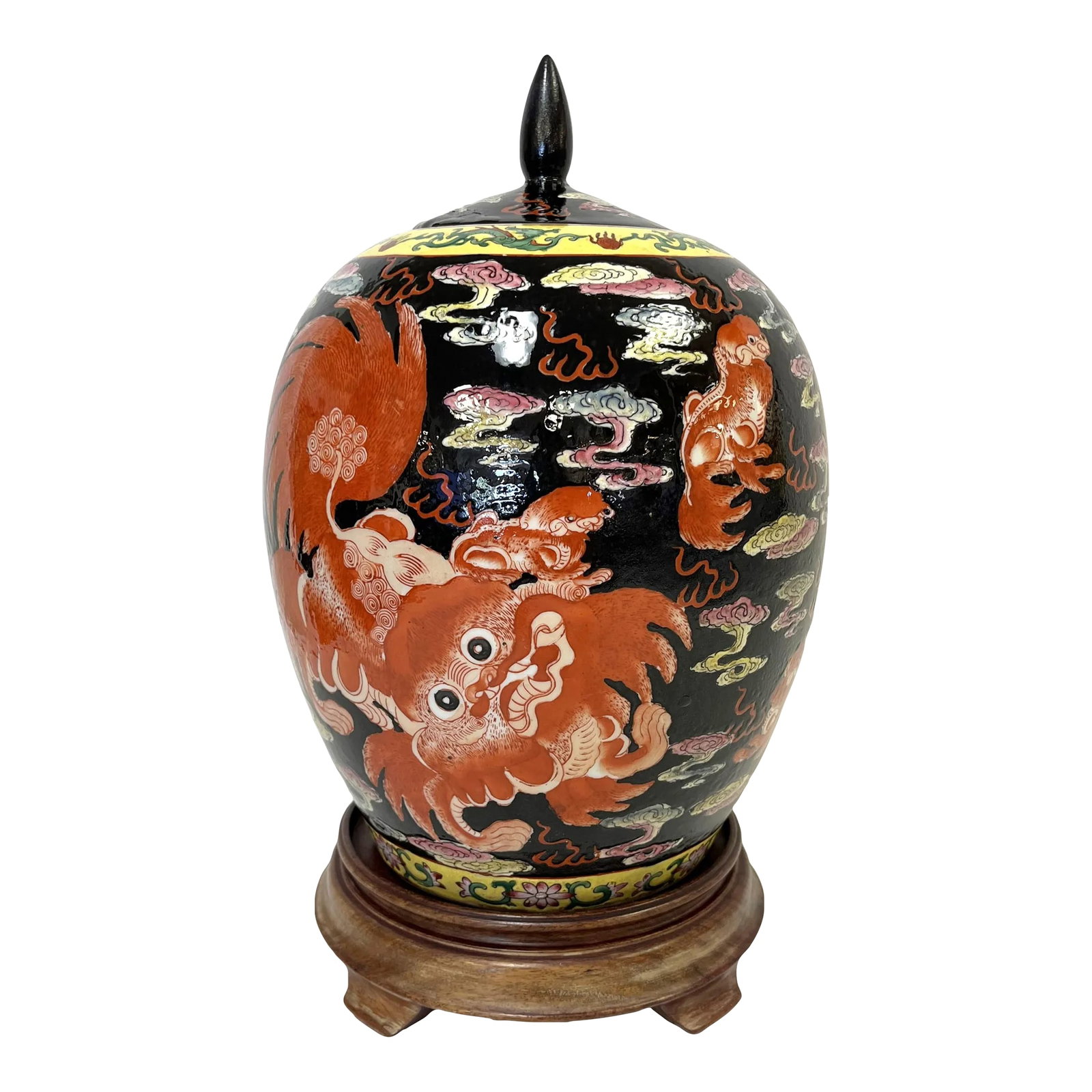 20th Century Chinese Famille Noir Porcelain Lidded Spice Jar With Foo Dragon Motifs: Striking early 20th Century Chinese Famille Noir spice jar. The unique piece is made of porcelain with a rich black background, and accented with bright orange Foo Dragon motifs. It's trimmed in a yel