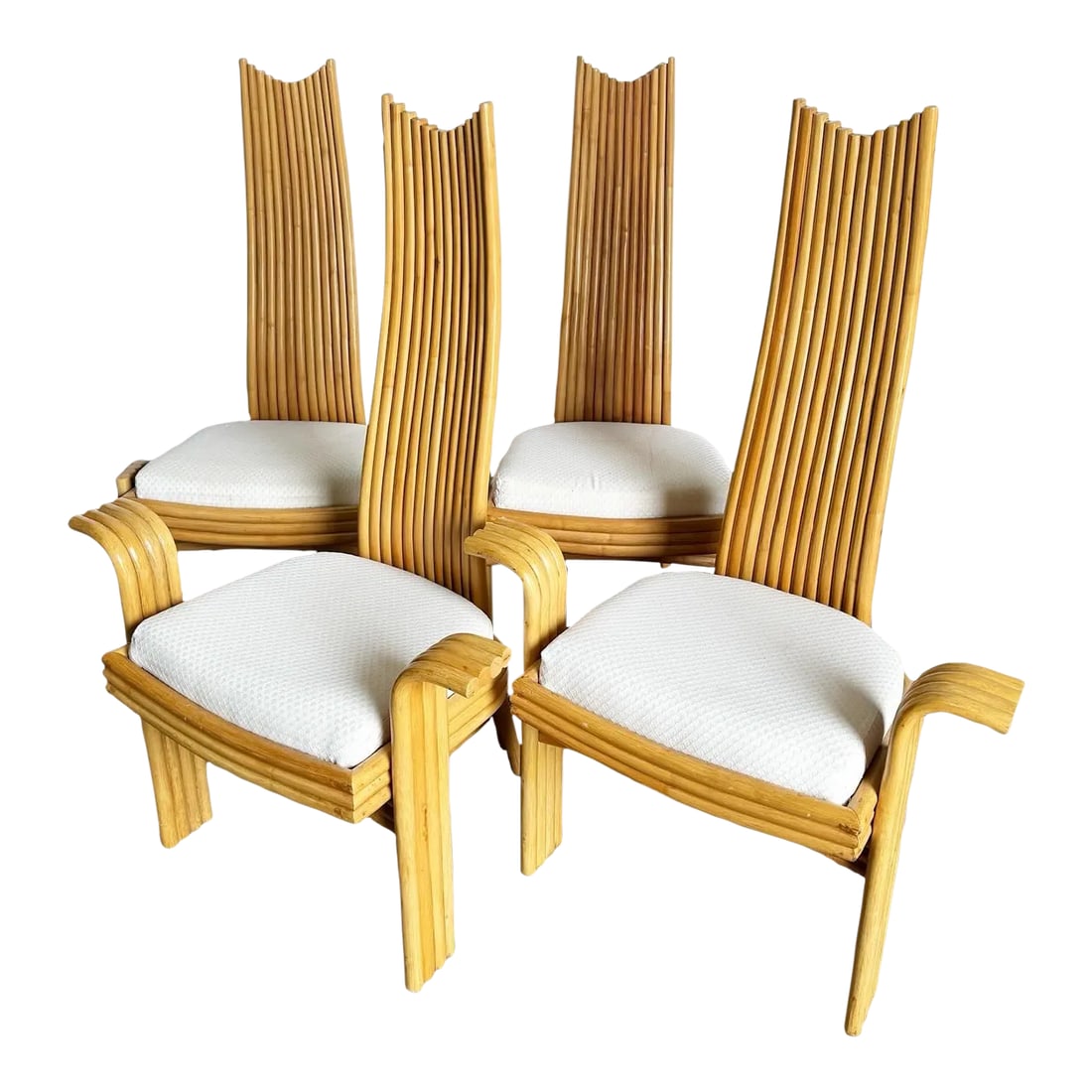Boho Chic High Back Rattan Dining Chairs - Set of 4: Elevate your dining experience with this set of Boho Chic High Back Rattan Dining Chairs. Crafted with exquisite attention to detail, each chair features a unique design that seamlessly blends style a