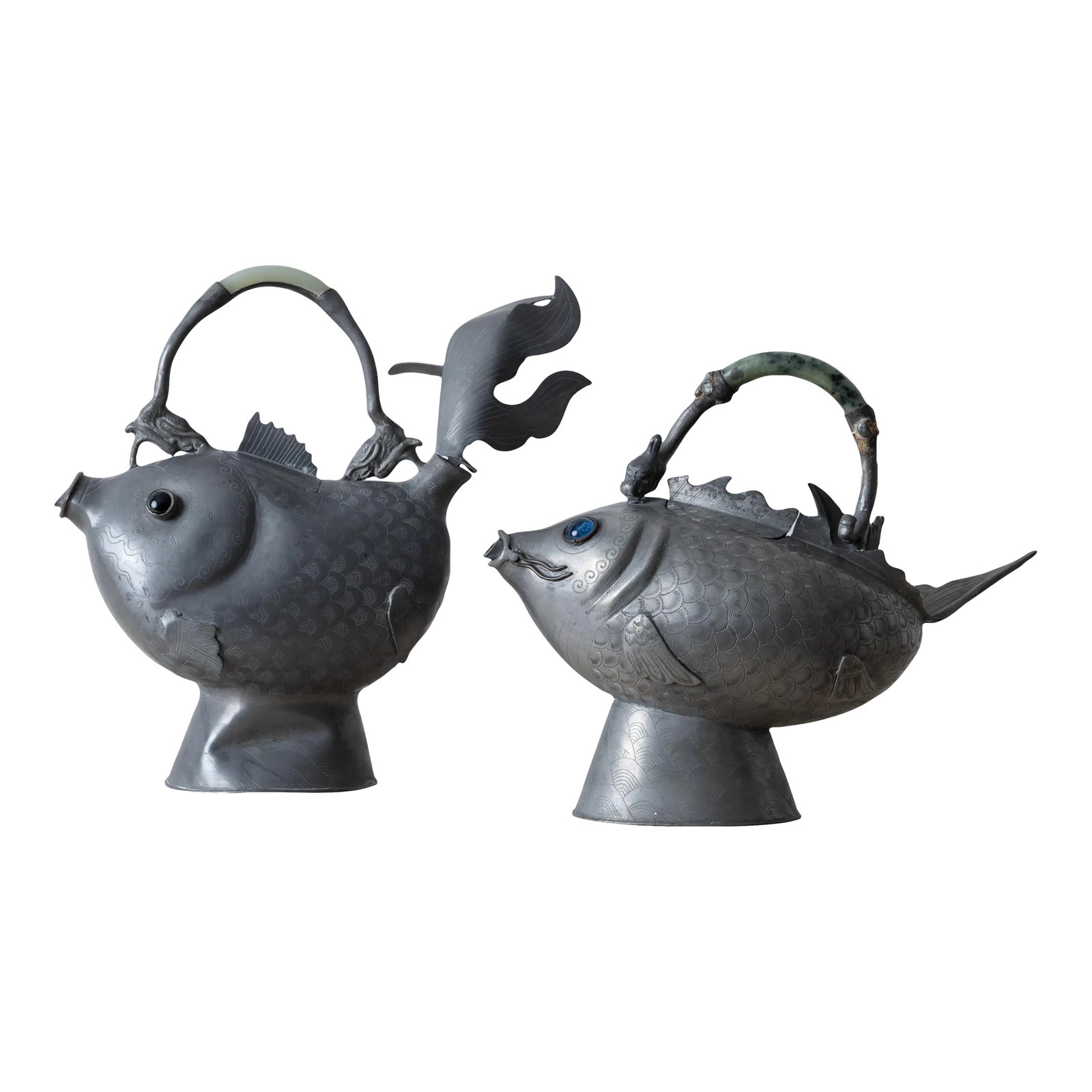 Chinese Pewter Koi Fish Teapots, 19th Century: A pair of Chinese pewter koi-form teapots, 19th Century. larger: 9 Â¾ inches wide by 4 inches deep by 9 Â¼ inches tall smaller: 9 Â½ inches wide by 4 Â½ inches