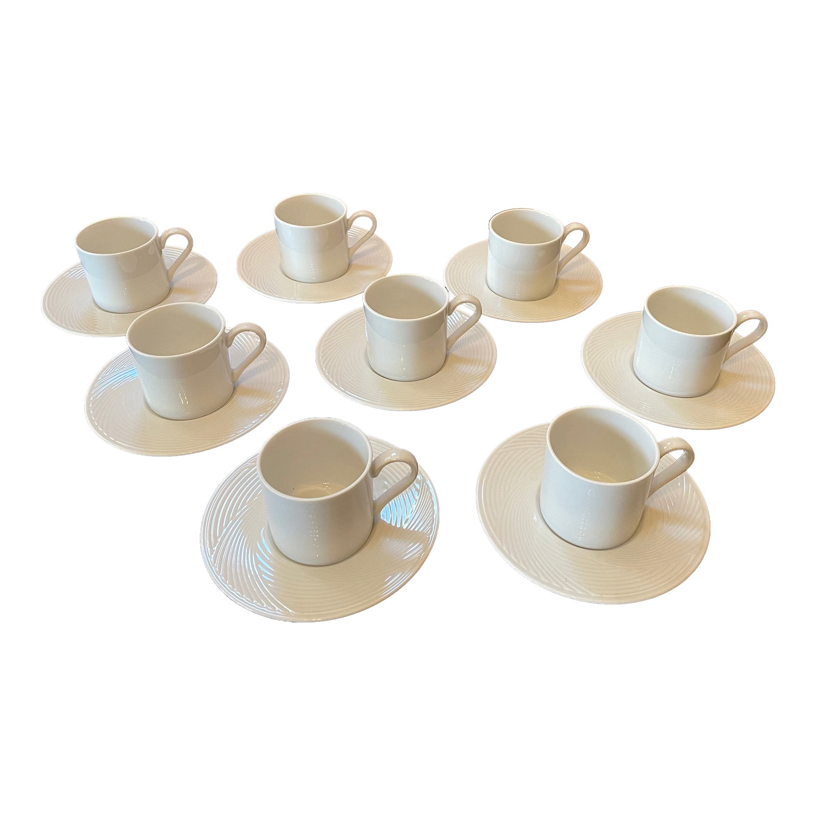 1960s Dansk White Porcelain Demitasse Cups and Saucers Set- 16 Pieces: This vintage set of eight porcelain Dansk demitasse cups and saucers is in perfect condition! The color is 'Winter White.' The cup, made of a smooth porcelain and designed with simple graceful line,